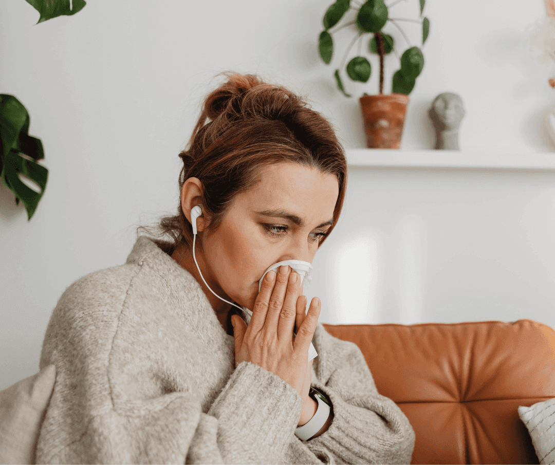 Sick patient blowing nose because of colds.